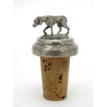Bottle stopper : A cork bottle stopper surmounted by a model of a dog 2 1/4" high overall