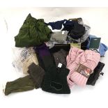A quantity of assorted clothing to include socks, gloves, baseball caps, trousers etc.