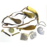 An assortment of muzzleloading black powder percussion flintlock long gun accessories,