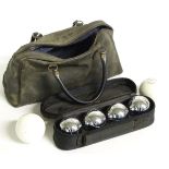 A cased set of four Parlane boules and two associated jacks, one by Slazenger.