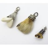 Hunting trophy pendants to include one set with deers tooth 1” long (3) CONDITION: