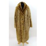 A vintage long length fur coat,