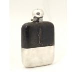 A hip flask with half leather covering and silver plate beaker to lower maker James Dixon & Sons 6"
