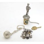 Assorted items comprising a silver football key chain together with a gilt metal tennis racket