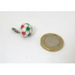 A novelty charm / pendant formed as a football 1/2" diameter CONDITION: Please Note