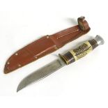 A vintage hunting knife and sheath by J Nowill & Sons, Sheffield.