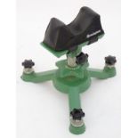 A Remington bench-mounting rifle rest, adjustable for height, angle and rotation.