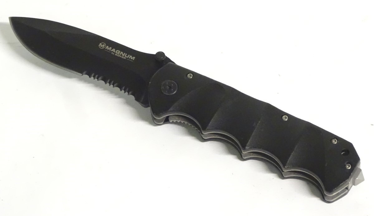 A Magnum by Boker tactical lock knife, with composite grip and 4 1/2" blade with saw. - Image 2 of 8