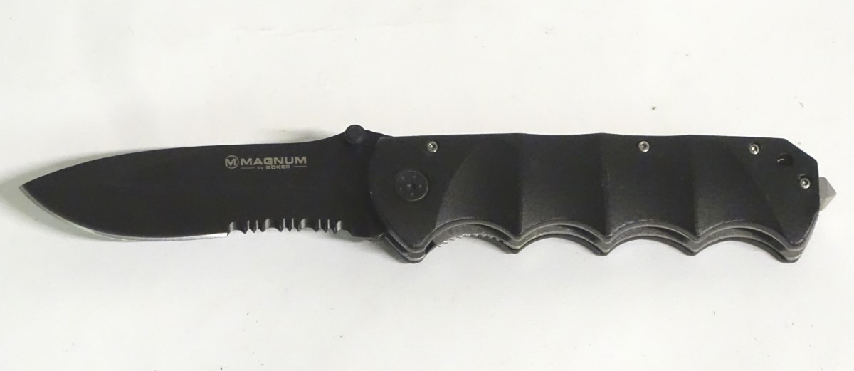 A Magnum by Boker tactical lock knife, with composite grip and 4 1/2" blade with saw. - Image 3 of 8