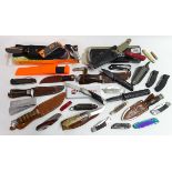 A large collection of approximately 30 hunting, military and utility knives,