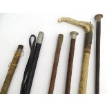 A quantity of assorted hunting whips and riding crops. Together with an antler handled cane / stick.
