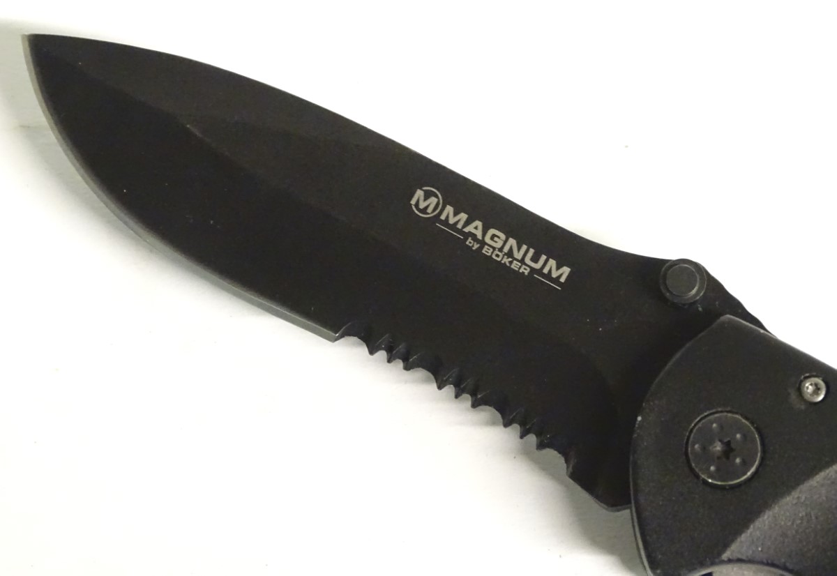 A Magnum by Boker tactical lock knife, with composite grip and 4 1/2" blade with saw. - Image 6 of 8