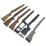 A selection of rifle stocks, to include walnut,