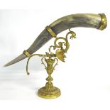 A late 19th / early 20thC bovine horn ornament with brass mounts,