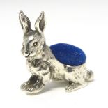 A novelty white metal pin cushion formed as a hare / rabbit 1" long CONDITION: