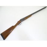 Shotgun: a Ugartechea 12 bore side by side boxlock non-ejector,