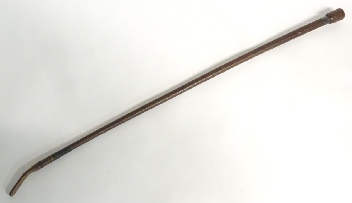 Hunting: A woven leather riding crop by Swaine Adeney Briggs, Sabson Centre, London,