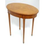 A satinwood oval side table CONDITION: Please Note - we do not make reference to