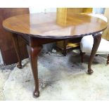 A mahogany circular dining table,