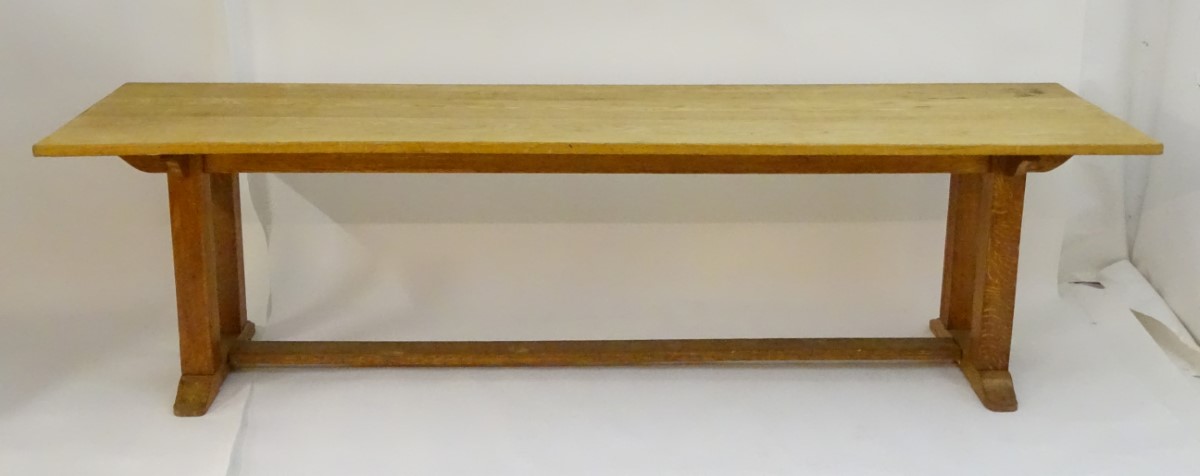An early 20thC large Arts & Crafts style oak dining / refectory table with a rectangular top above - Image 3 of 9