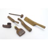 An assortment of antique roofing tools, together with a carved model of an Inuit mukluk boot.
