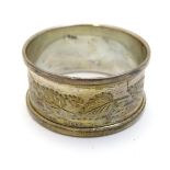 A silver napkin ring hallmarked Birmingham 1973 maker Henry Griffith & Sons.