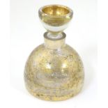 A 20thC squat formed scent bottle and stopper by LSA Poland, with burnished gold finish,