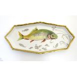 A Villeroy and Boch elongated oblong serving dish with fish decoration and a gilt rim. Marked under.