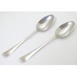 A pair of 18thC silver picture back teaspoons maker AB 4 3/4" CONDITION: Please