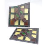 A pair of early 20thC lead and stained glass window / door panels, of irregular quadrilateral form,