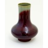 A Chinese sang de boeuf two tone vase with a crackle glaze. Character marks under. 11 1/2" high.
