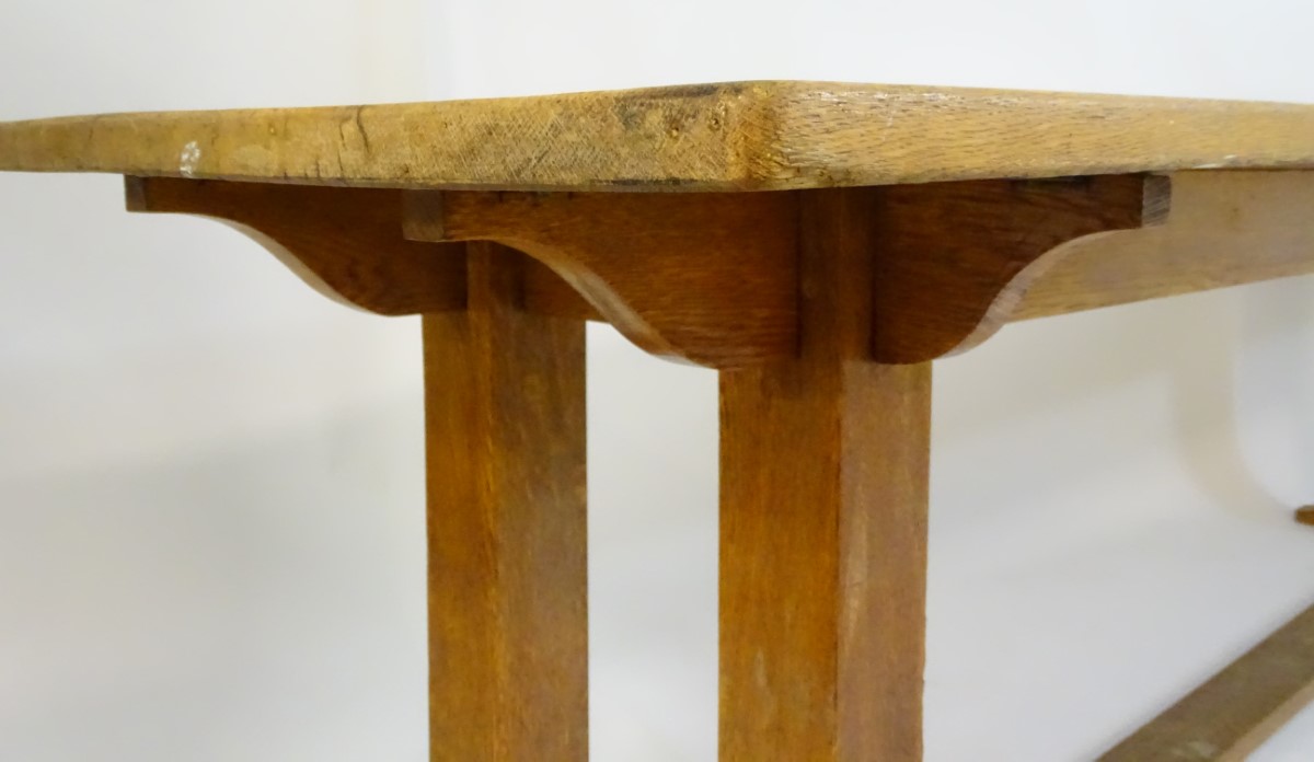 An early 20thC large Arts & Crafts style oak dining / refectory table with a rectangular top above - Image 8 of 9