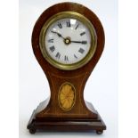 An early to mid 20thC mantel clock, the mahogany balloon case with boxwood inlays,