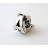 A silver charm of bead form formed as the letters 'A' CONDITION: Please Note - we