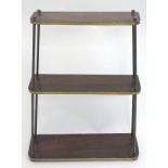 A graduated three tier shelf with metal supports. Approx. 23 1/2" high.