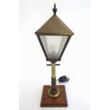 An early to mid 20thC novelty table lamp formed as a street light,