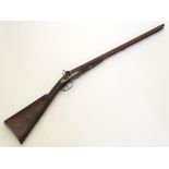 An 19thC American 10 bore side by side percussion muzzleloading black powder hammergun by J. E.