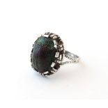 An early 20thC silver ring set with scarab beetle in the Egyptian Revival style. Ring size approx.