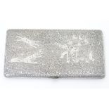 A large silver cigarette case with profuse acanthus scroll decoration and engraved detail of