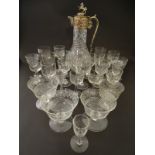A quantity of assorted drinking glasses of various sizes together with a cut glass claret jug with