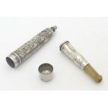 A silver cheroot mouthpiece case containing a silver mounted holder.