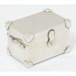 A novelty white metal pill box formed as a trunk 1 3/4" long x 1" high x 1" wide