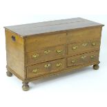 A late 18thC mule chest with a rectangular lid above two faux drawers and two short drawers with