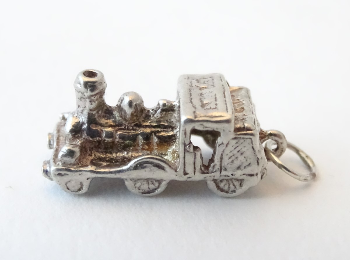 A novelty silver pendant charm formed as a steam train. Approx. 3/4" long. - Image 5 of 6