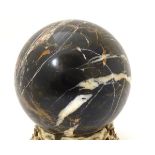 A polished specimen hardstone sphere. Approx.
