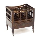 A Regency Canterbury with four open sections separated by slatted dividers,