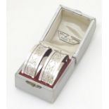 A cased pair of silver napkin rings Hallmarked Birmingham 1934 with silver jubilee mark maker
