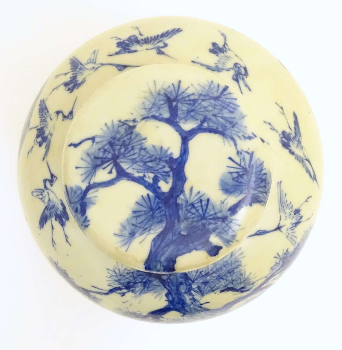 A large blue and white Japanese lidded ginger jar decorated with a sage sat by a tree in a - Image 5 of 7