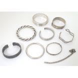Assorted silver and white metal bangles and bracelets including a bangle hallmarked Birmingham 1980,