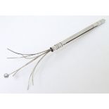 A retractable Sterling Silver swizzle stick Approx 3" long closed CONDITION: Please